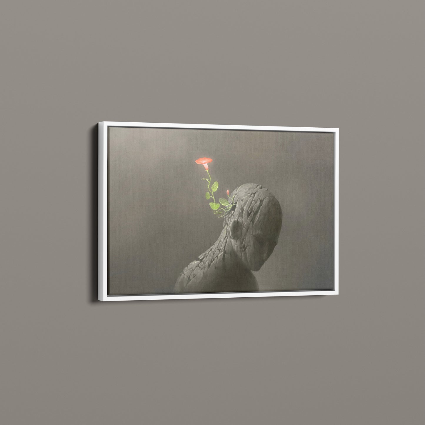 Red flower on broken human sculpture