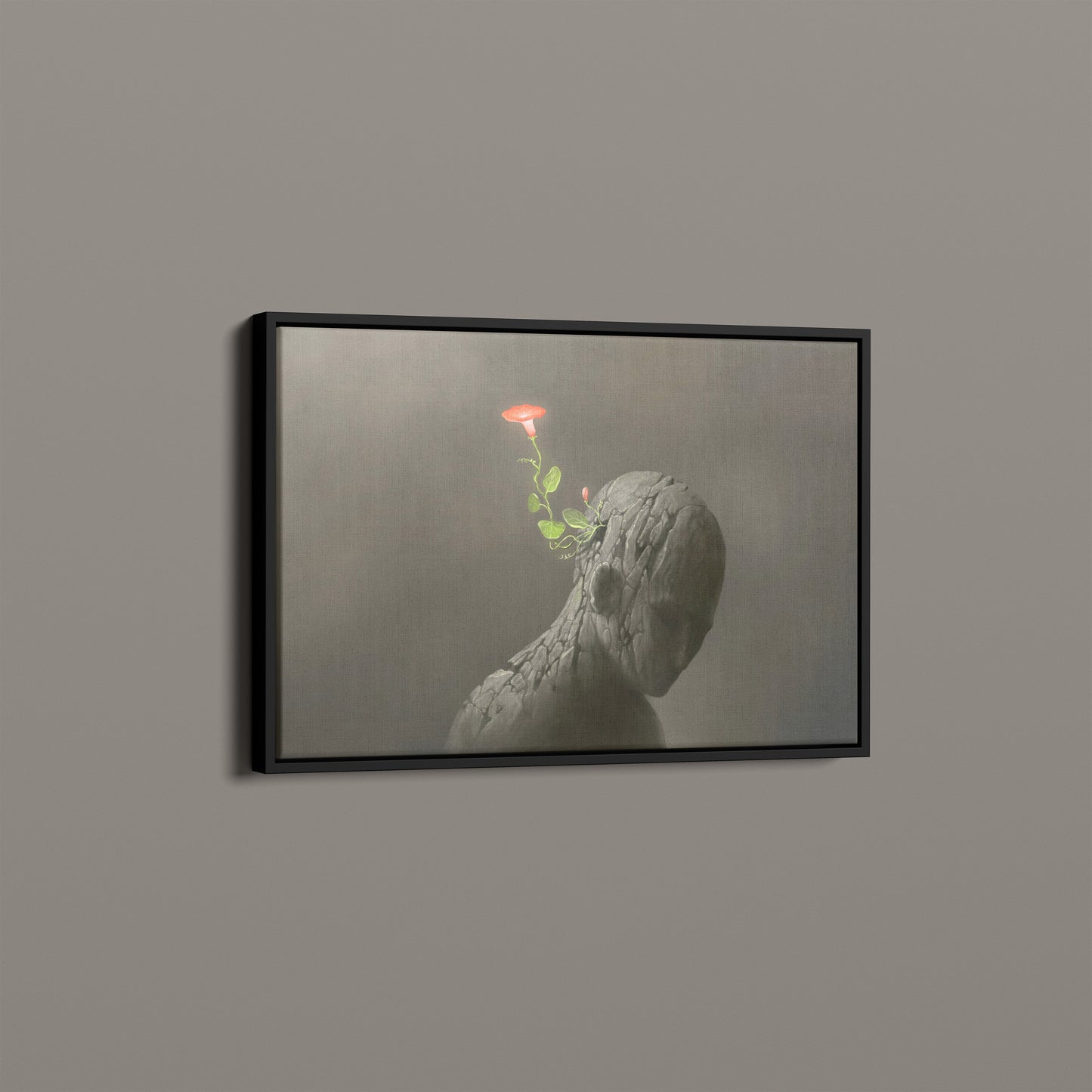 Red flower on broken human sculpture
